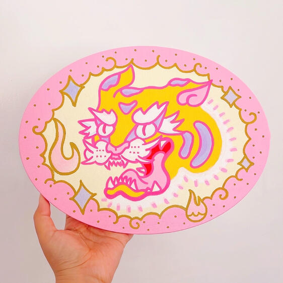 Acrylic painting of an orange tiger surrounded by pastel pink flames, a pink bubbly border, and gold details.